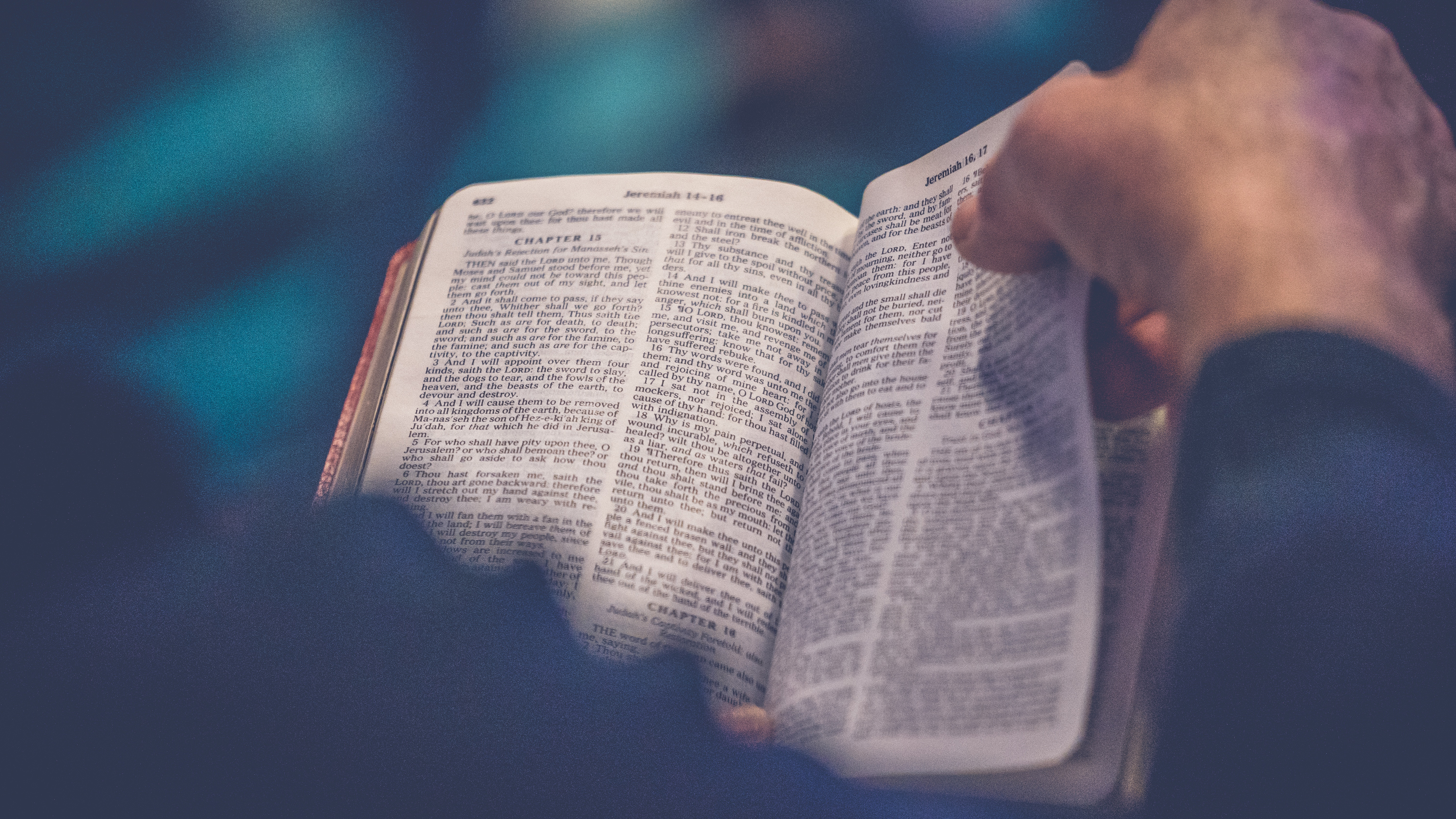 Man_holding_Bible_RodLongUnsplash_775x436